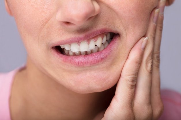 đau nhức sau khi sau khi nhổ răng khôn